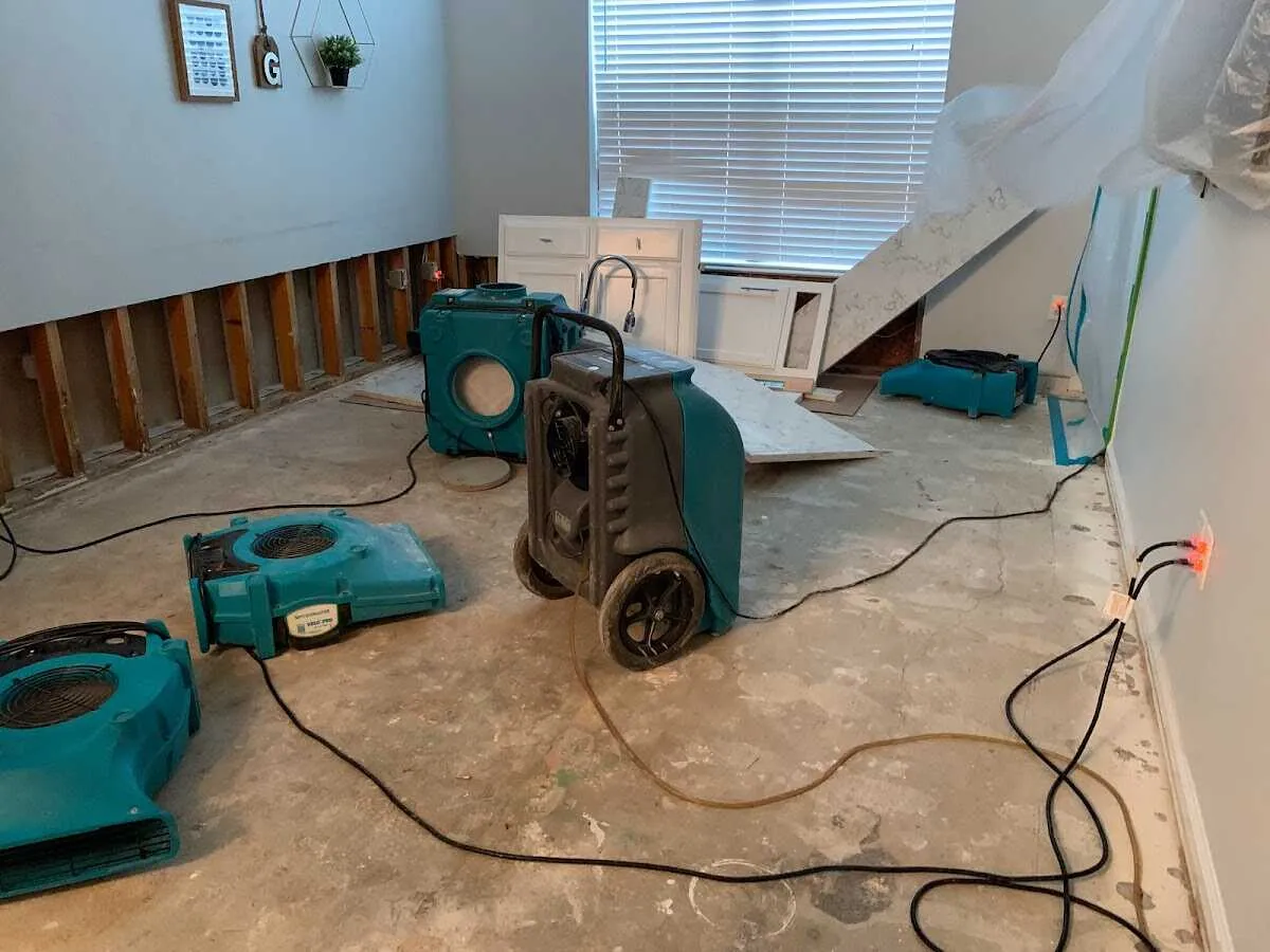 Dehumidifier in flood-cut room for Water Damage Restoration in Dickinson